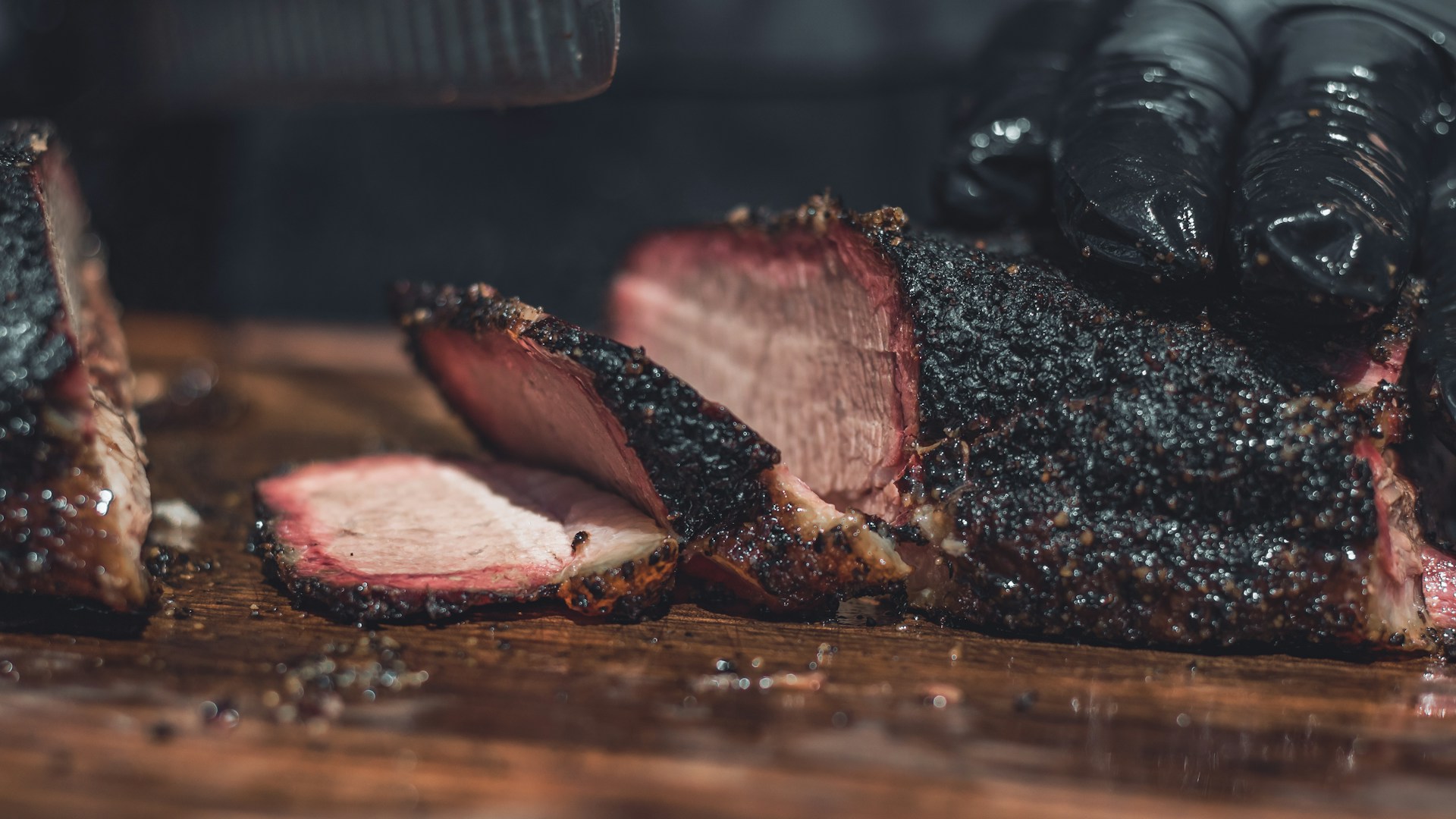 Sliced smoked meat with a dark exterior